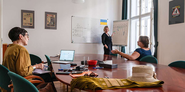 Office in Prague with three persons working