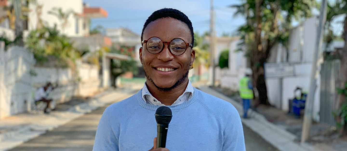 A man standing with a microphone